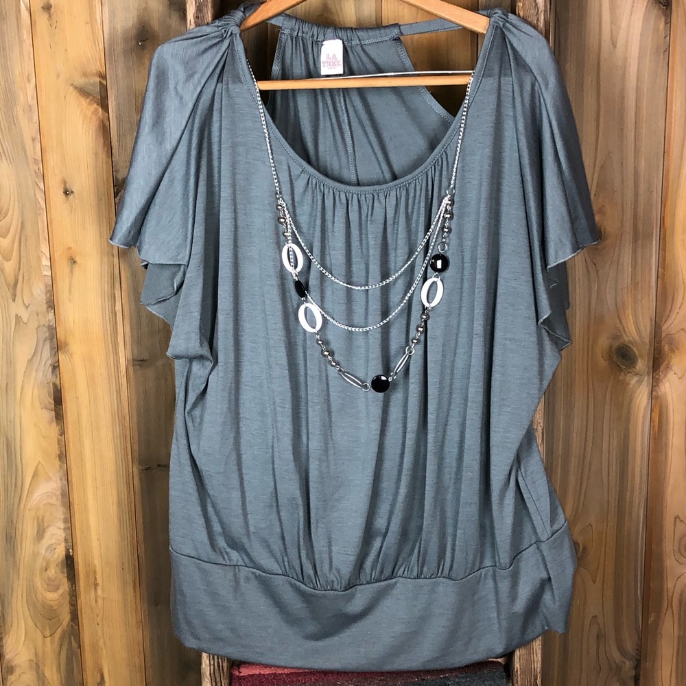 Grey bat winged blouse with built in necklace.